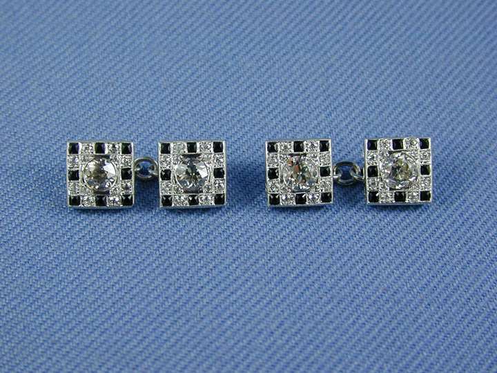 Pair of onyx and diamond square panel cufflinks, open set in platinum, four sides alike